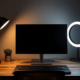 Home office desk with lamp, monitor, and ring light for balanced lighting
